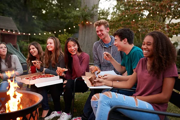 teens-eating-teenagers-pizza-camp-fire-1